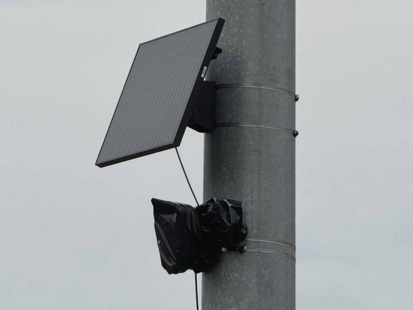 Flock Camera covered with a plastic bag.